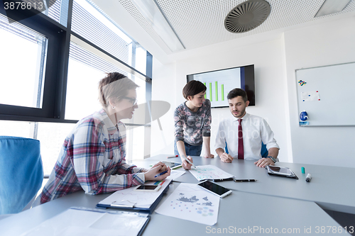 Image of young business people group on meeting at modern office