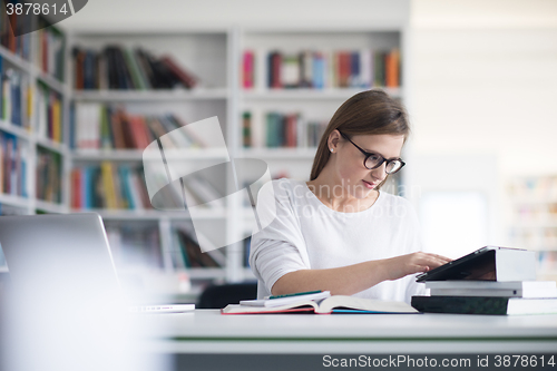 Image of female student study in school library