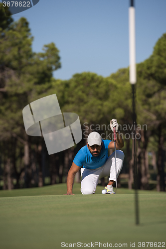 Image of golf player aiming perfect  shot