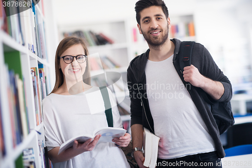 Image of students couple  in school  library