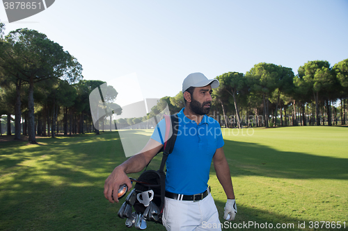 Image of golf player walking