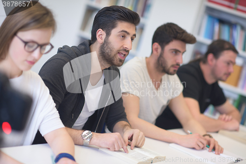 Image of group of students study together in classroom