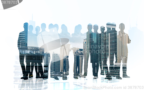 Image of business people silhouettes over city background