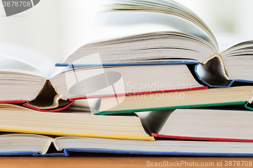 Image of close up of books on wooden table