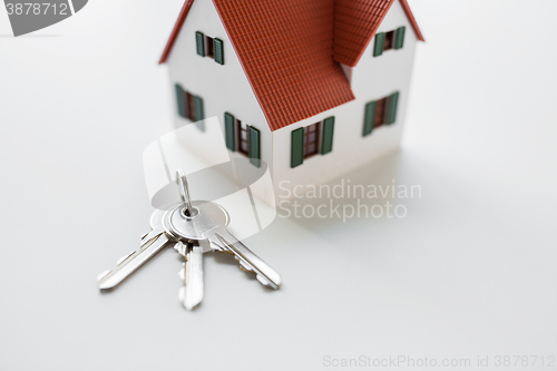 Image of close up of home model and house keys