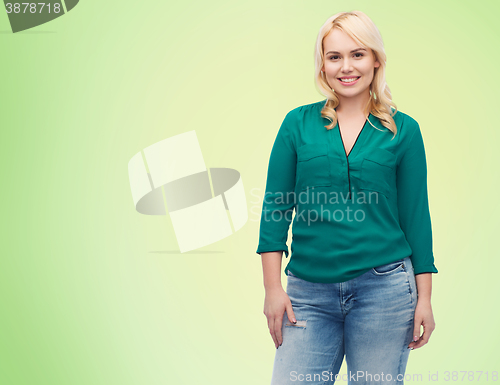 Image of smiling young woman in shirt and jeans