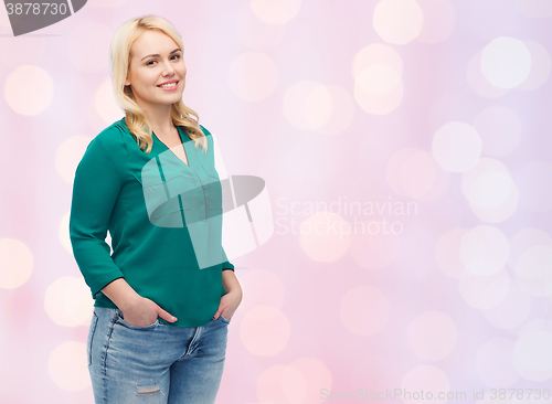 Image of smiling young woman in shirt and jeans