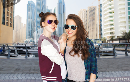 Image of happy smiling pretty teenage girls in sunglasses