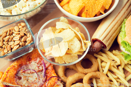 Image of close up of fast food snacks and drink on table