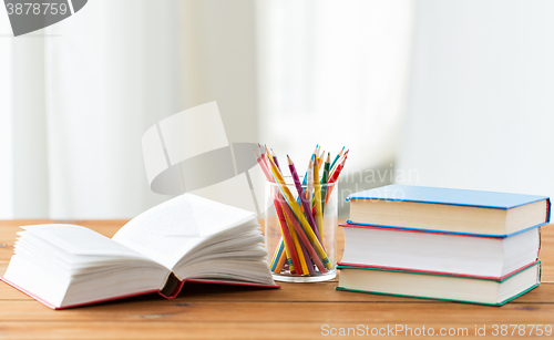 Image of close up of crayons or color pencils and books