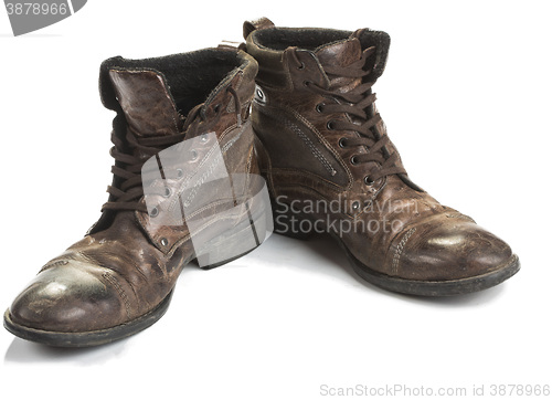 Image of Dirty old boots isolated. white background