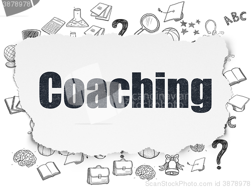 Image of Education concept: Coaching on Torn Paper background