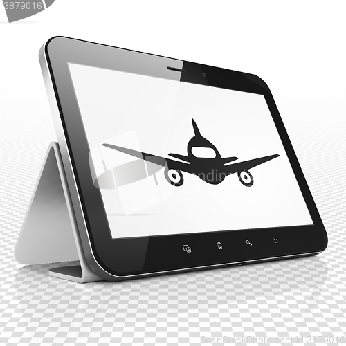 Image of Vacation concept: Tablet Computer with Aircraft on display