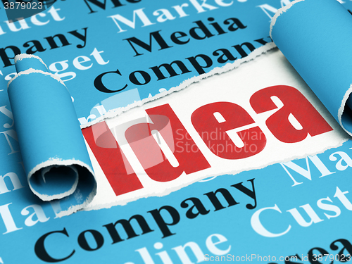 Image of Marketing concept: red text Idea under the piece of  torn paper