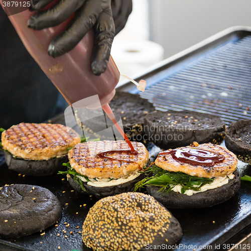 Image of Beef burgers ready to serve on food stall.