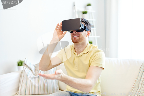 Image of young man in virtual reality headset or 3d glasses