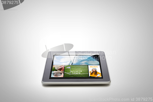 Image of close up of tablet pc with news application