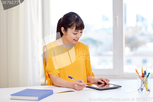 Image of asian woman student with tablet pc at home