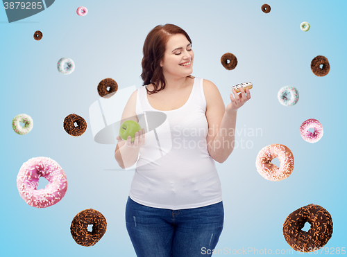 Image of happy plus size woman choosing apple or cookie