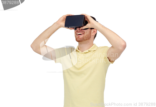 Image of happy man in virtual reality headset or 3d glasses