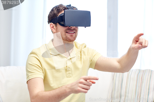 Image of young man in virtual reality headset or 3d glasses