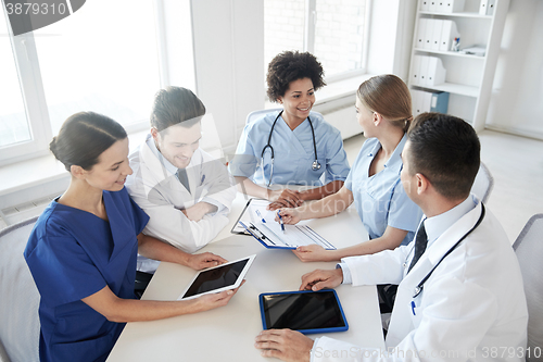Image of group of happy doctors meeting at hospital office