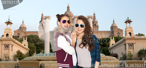 Image of happy smiling pretty teenage girls in sunglasses