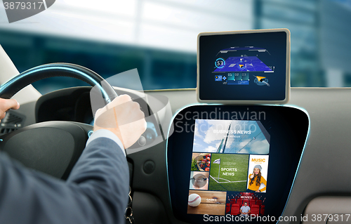 Image of close up of man with gps on tablet pc driving car