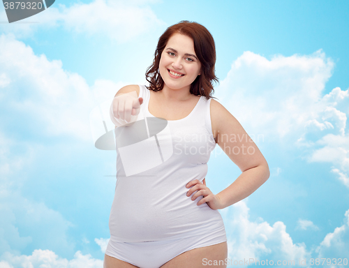Image of plus size woman in underwear pointing finger