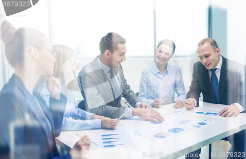 Image of smiling business team at meeting