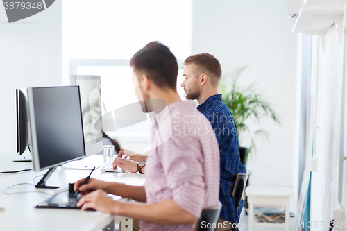 Image of creative man or student with computer at office