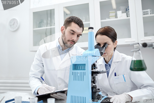 Image of young scientists making test or research in lab