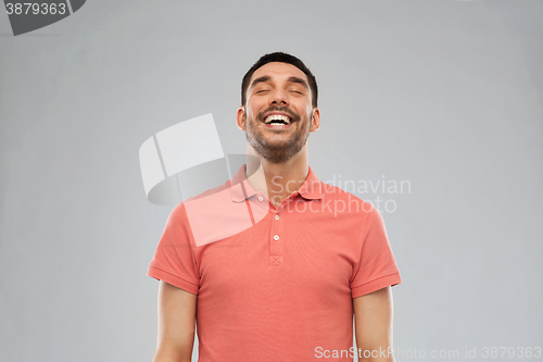 Image of laughing man over gray background