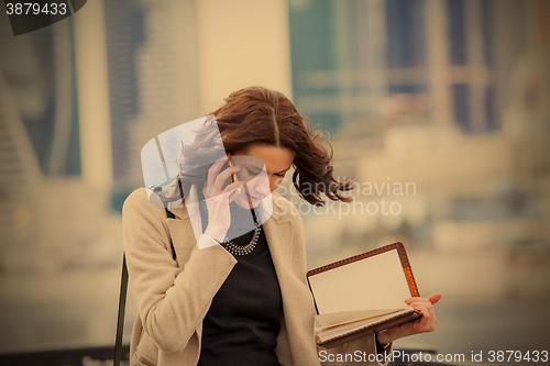 Image of business woman talking on the mobile