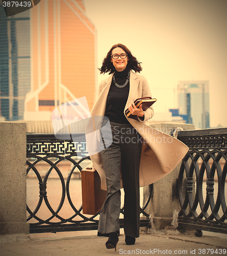 Image of woman in a bright coat