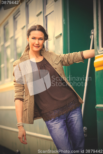 Image of smiling beautiful middle-aged woman traveler