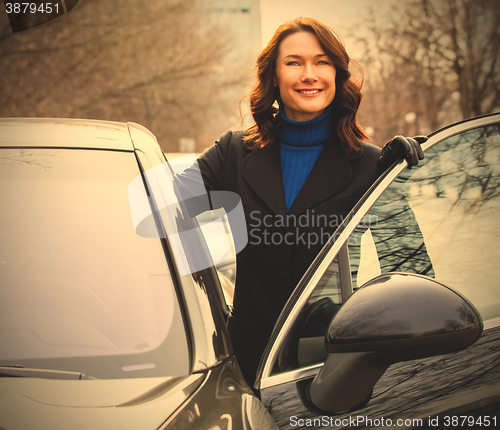 Image of woman sits in the car