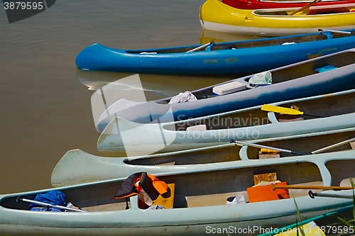 Image of Canoes on the Riverside