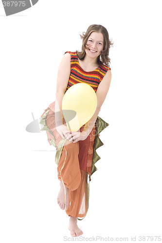 Image of Colorful dressed female with balloon