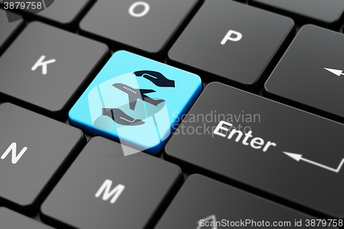 Image of Insurance concept: Airplane And Palm on computer keyboard background