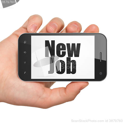 Image of Business concept: Hand Holding Smartphone with New Job on display