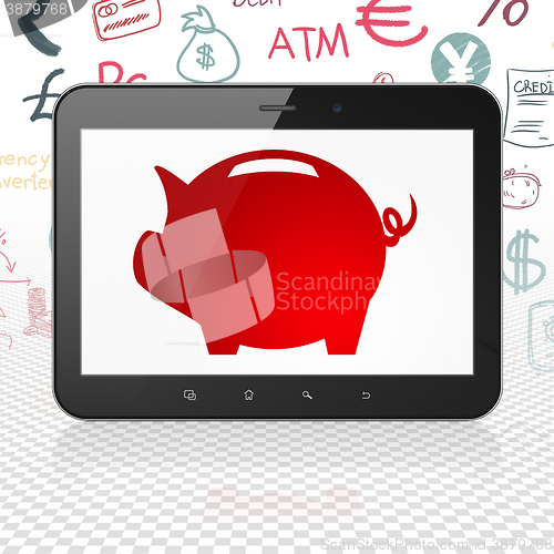 Image of Banking concept: Tablet Computer with Money Box on display