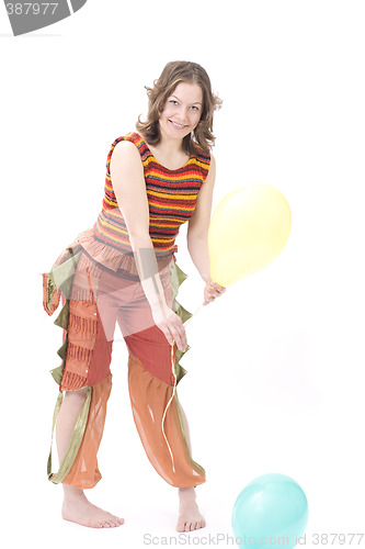 Image of Colorful dressed female with two balloons