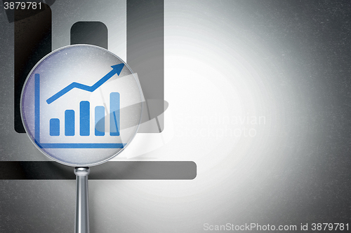 Image of Marketing concept:  Growth Graph with optical glass on digital background