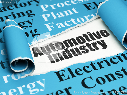Image of Manufacuring concept: black text Automotive Industry under the piece of  torn paper