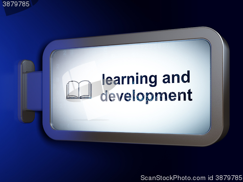 Image of Studying concept: Learning And Development and Book on billboard background