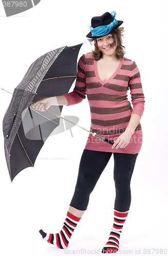 Image of Colorful dressed female with umbrella