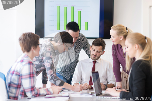 Image of young business people group on meeting at modern office