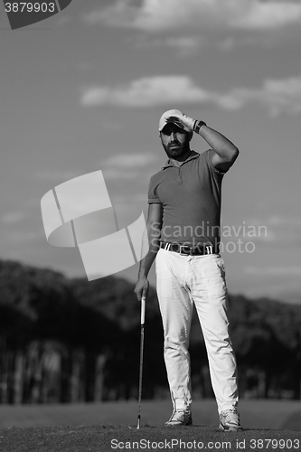 Image of handsome middle eastern golf player portrait at course