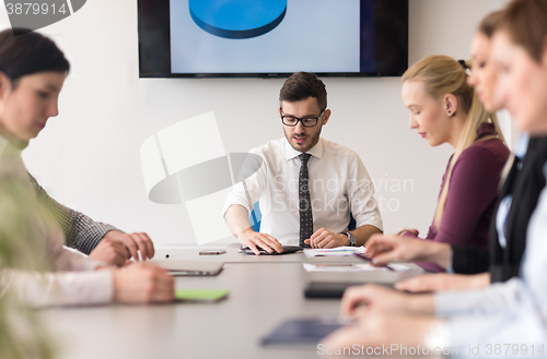 Image of young business people group on team meeting at modern office